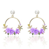 Elegante Goldohrringe mit Blumen