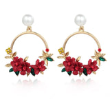 Elegante Goldohrringe mit Blumen